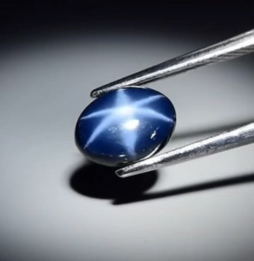 3.31 carat star sapphire cabochon with strong asterism, gently heat treated