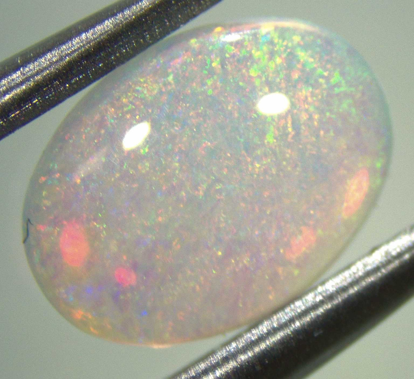 0.44 carat Australian opal from Lightning Ridge, vibrant play of color