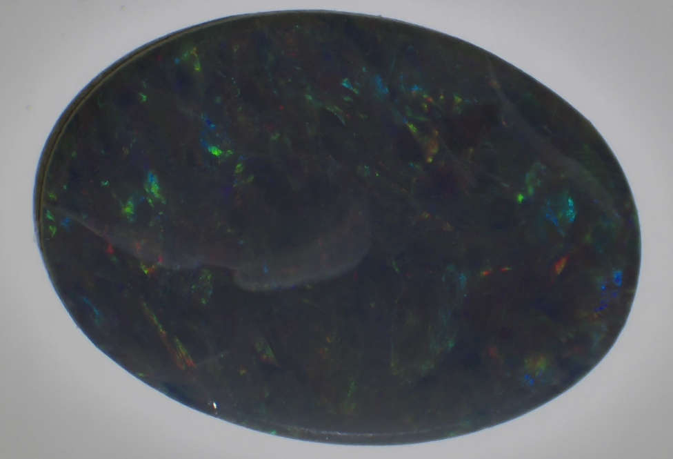 Blue Opal Australia, 0.50 Carats, Doublet on Ironstone, 7mm by 5mm.